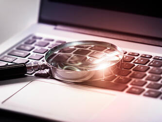 Magnifying glass keyboard probe search investigation inquiry jun26_crop